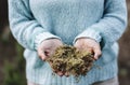 Close up of woman hands holding green natural musk in the nature outdoors leisure activity. Concept of alternative medicine and