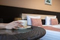 Close up of a woman hands holding a hot coffee cup