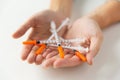 Close up of woman hands holding insulin syringes