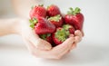 Close up of woman hands holding strawberries Royalty Free Stock Photo