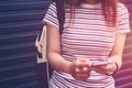 Close up of woman hands holding touching mobile phone with blank copy space for your text message in cafe with light Sunset,Vintag Royalty Free Stock Photo