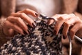 Close-up of woman hands knitting colorful wool Royalty Free Stock Photo