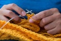 Close up of woman hands knitting colorful wool yarn Royalty Free Stock Photo