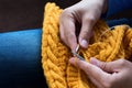 Close up of woman hands knitting colorful wool yarn