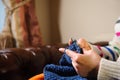 Close-up of woman hands knitting colorful wool yarn. Royalty Free Stock Photo