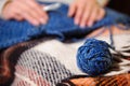 Close-up of woman hands knitting colorful wool yarn. Royalty Free Stock Photo