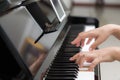 Close up of woman hands playing piano on background Royalty Free Stock Photo