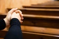 Close up of a woman hands praying at the church Royalty Free Stock Photo