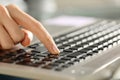 Woman hands pressing enter button on a keyboard Royalty Free Stock Photo