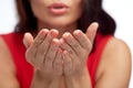 Close up of woman hands sending blow kiss