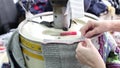 Close up of woman hands sewing an overlock at sewing machine