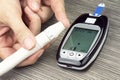 Close-up Of Woman Hands Testing High Blood Sugar With Glucometer.