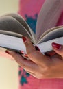 Close up on woman hands turning page in vintage book. Woman read a book Royalty Free Stock Photo