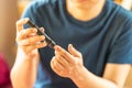 Close up of woman hands using lancet on finger to check blood sugar level by Glucose meter. Use as Medicine, diabetes, glycemia, Royalty Free Stock Photo