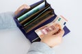 Close up of woman hands with wallet and euro money Royalty Free Stock Photo