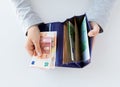 Close up of woman hands with wallet and euro money Royalty Free Stock Photo