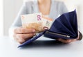 Close up of woman hands with wallet and euro money Royalty Free Stock Photo