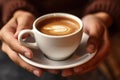 Woman hands holding fresh made cappuccino