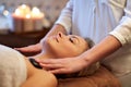 Close up of woman having hot stone massage in spa Royalty Free Stock Photo