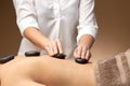 Close up of woman having hot stone massage at spa Royalty Free Stock Photo