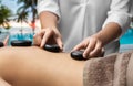 close up of woman having hot stone massage at spa Royalty Free Stock Photo