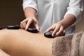 Close up of woman having hot stone massage at spa Royalty Free Stock Photo