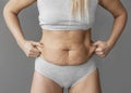 close up woman holding belly fat. High quality photo Royalty Free Stock Photo