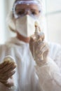 Close-up of woman holding bottle of antiseptic and cotton Royalty Free Stock Photo