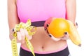 Close-up of woman holding fruits and tape line Royalty Free Stock Photo