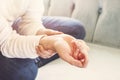 Close up Woman holding her wrist, pain concept.