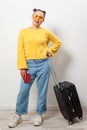 Close-up woman holding a passport and travel bag in her hands. Travel, immigration, emigration