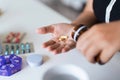 Close up woman holding pill in hand with water feeling sick. female going to take painkiller from headache, painkiller