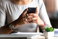 Close up woman holding smartphone, typing message Royalty Free Stock Photo