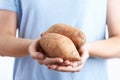 Close Up Of Woman Holding Sweet Potato