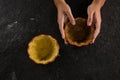 Woman holding tart dough on mold