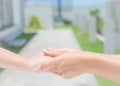 Close up of woman holds the hand of a lovely child. Royalty Free Stock Photo