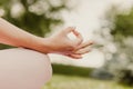 close-up of woman index finger and thumb in symbol of meditation and contemplation in park in summer Royalty Free Stock Photo