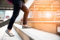 Close up of woman legs walking up stair in the city. Business an