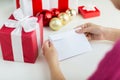 Close up of woman with letter and presents Royalty Free Stock Photo