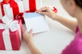 Close up of woman with letter and presents Royalty Free Stock Photo