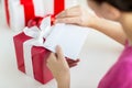 Close up of woman with letter and presents Royalty Free Stock Photo