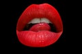Close-up woman licking red lips. Sexy mouth, sensual lips. Royalty Free Stock Photo