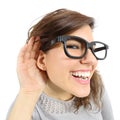 Close up of a woman listening with her hand in the ear