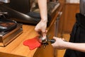 Close up of woman making coffee by machine at cafe