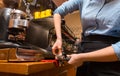 Close up of woman making coffee by machine at cafe