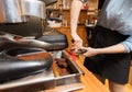 Close up of woman making coffee by machine at cafe