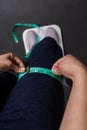 Close up woman measuring thigh and leg size with tape, health and weight concept Royalty Free Stock Photo