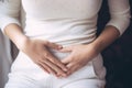 Close up of woman with menstrual cramps clutching stomach in pain Royalty Free Stock Photo