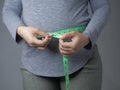 Measuring Waistline With Measurement Tape