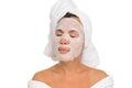 Close-up of woman with moisturizing face mask, eyes closed, white isolated background. Royalty Free Stock Photo